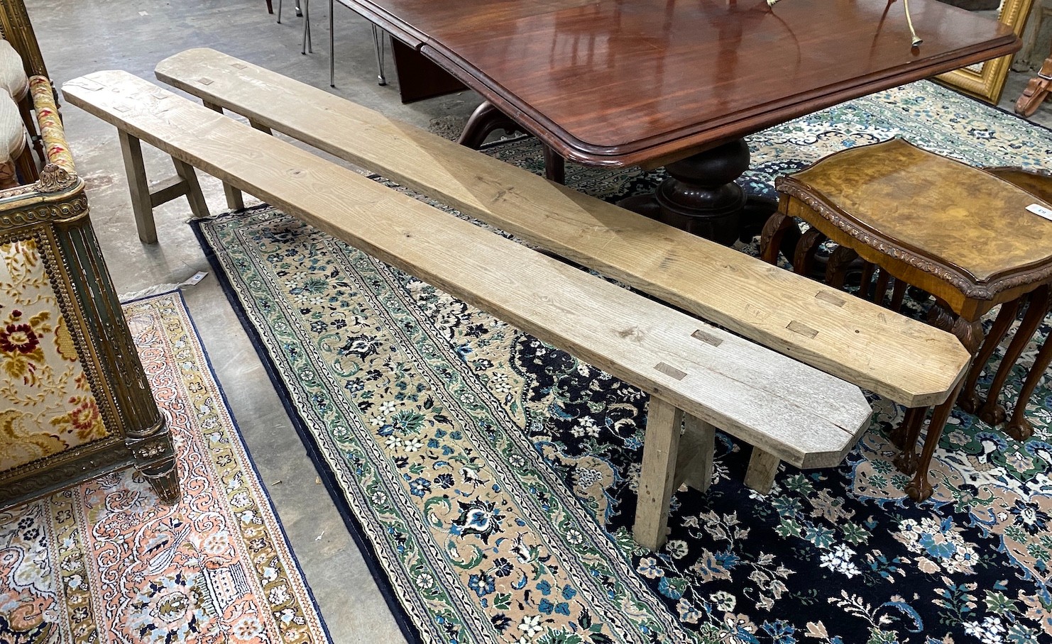 A pair of 19th century provincial elm benches, length 260cm, width 21cm, height 44cm